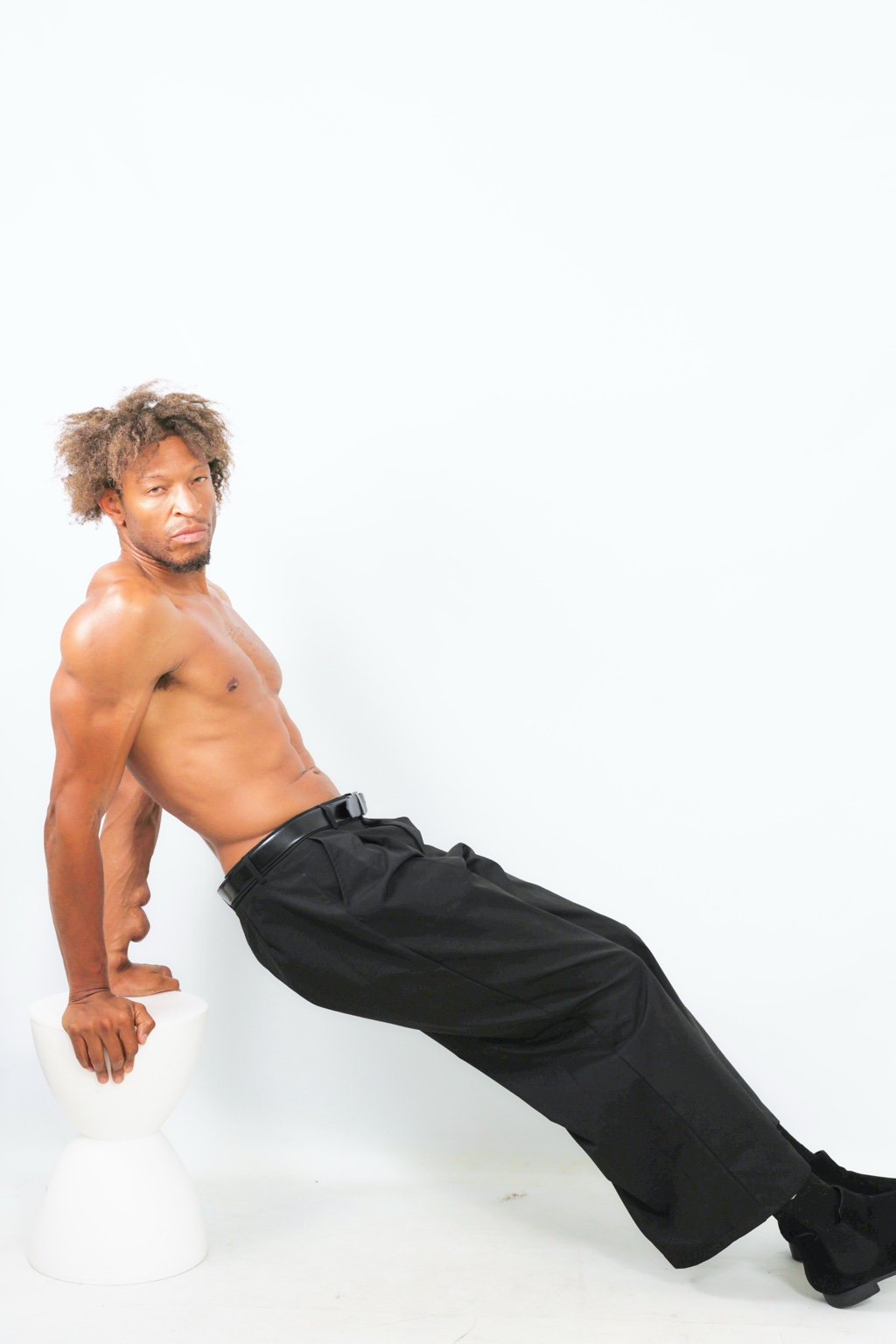 Editorial studio leaning pose